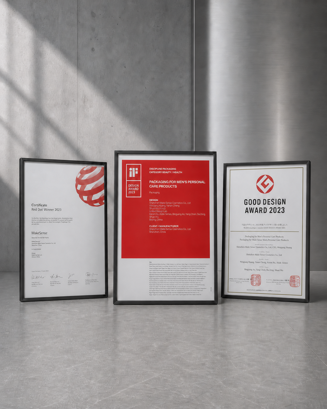 Framed iF Design Award 2023, Red Dot Winner 2023 and Good Design Award 2023 certificates in a gallery setting / 展陈空间中的 iF、红点与日本优良设计奖证书
